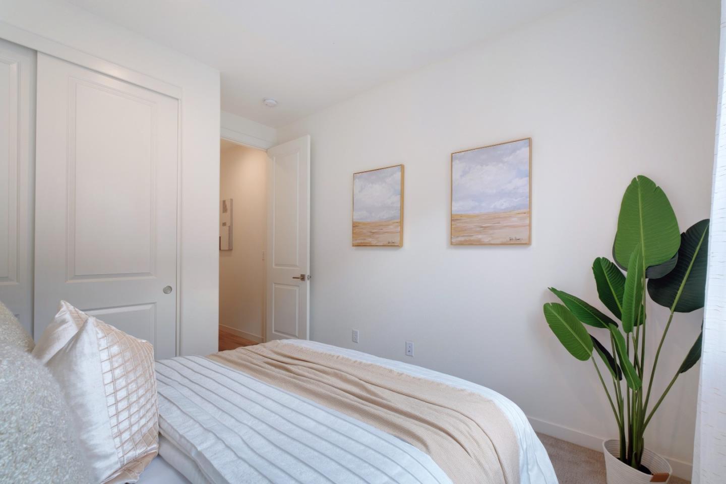 1888 Joshua Tree Circle Milpitas, CA 95035 - Photo 30 of 50 a bedroom with a bed with a potted plant