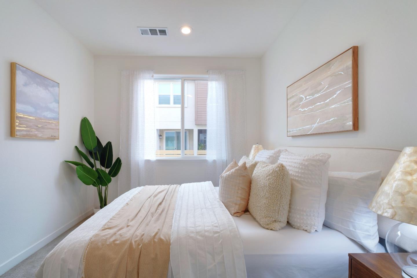 1888 Joshua Tree Circle Milpitas, CA 95035 - Photo 31 of 50 a bedroom with a bed and a potted plant