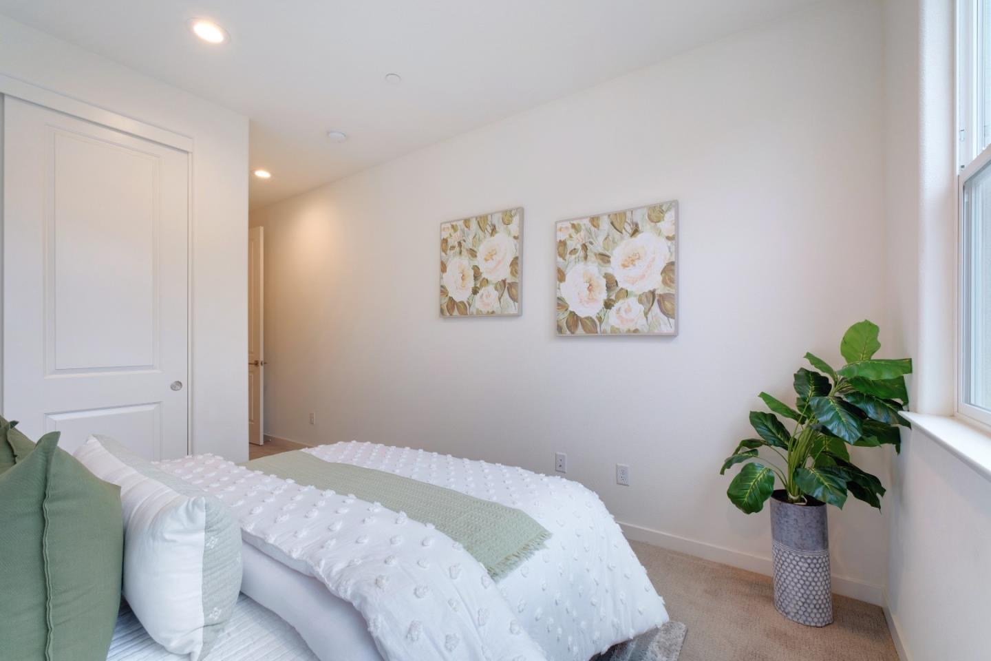 1888 Joshua Tree Circle Milpitas, CA 95035 - Photo 33 of 50 a bedroom with a bed and a potted plant