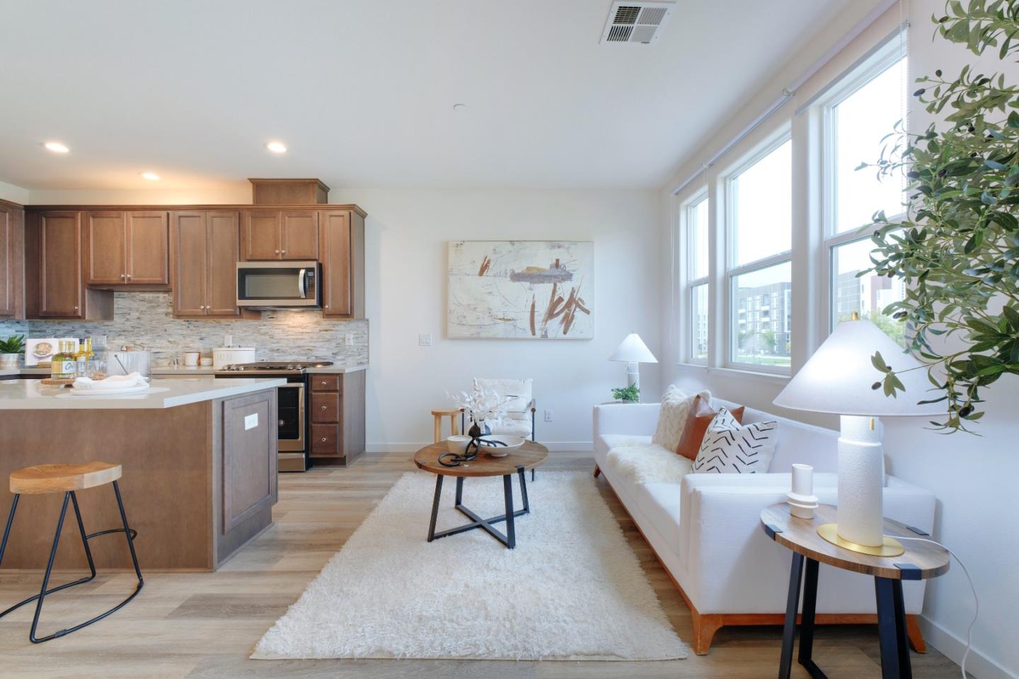 1888 Joshua Tree Circle Milpitas, CA 95035 - Photo 5 of 50 a living room with furniture and a kitchen area