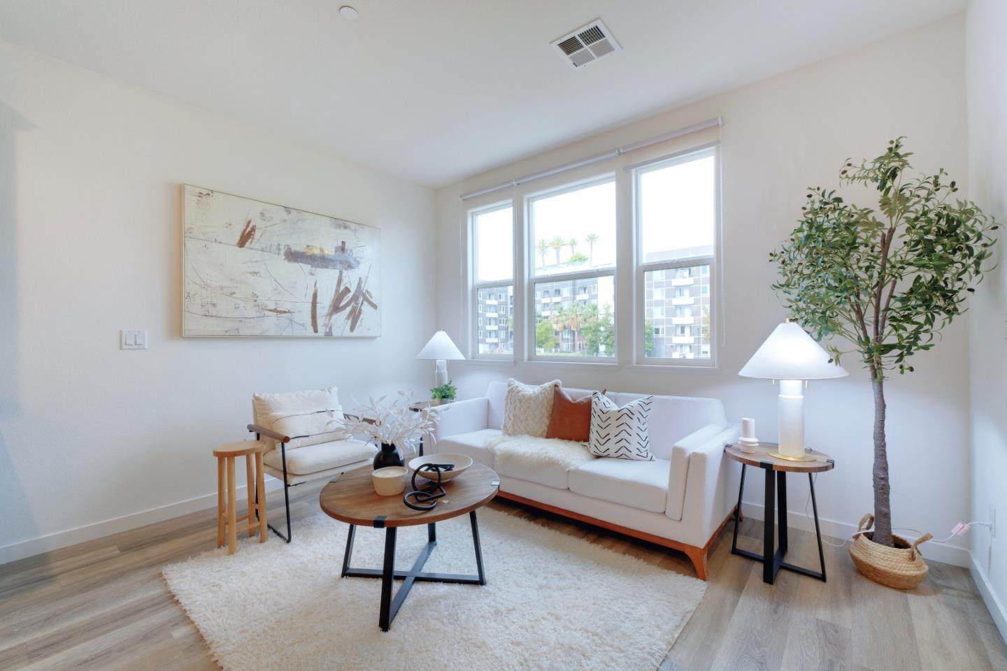 1888 Joshua Tree Circle Milpitas, CA 95035 - Photo 6 of 50 a living room with furniture a table and a potted plant