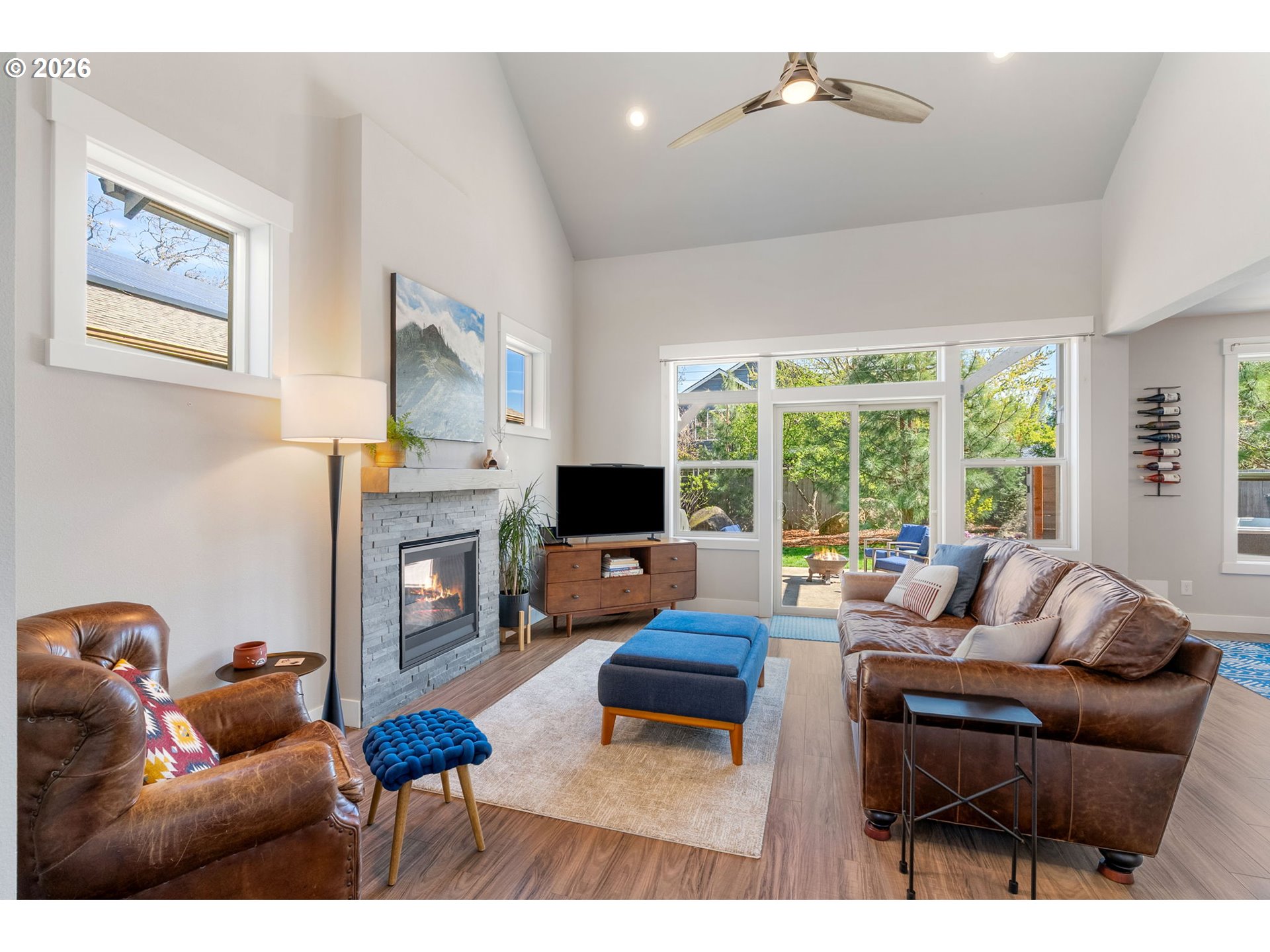921 Goose Way Hood River, OR 97031 - Photo 3 of 44 a living room with furniture a fireplace and a large window