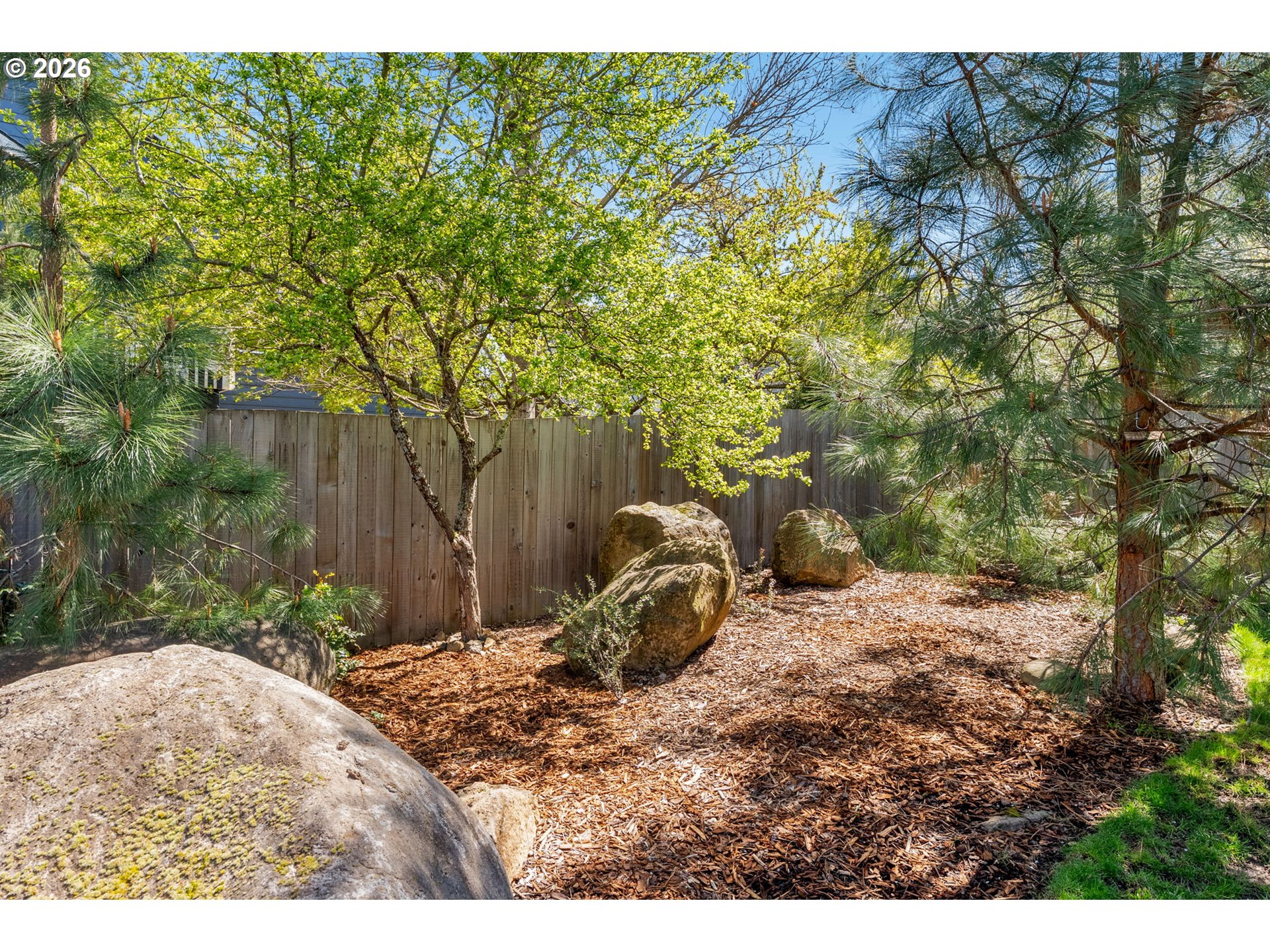 921 Goose Way Hood River, OR 97031 - Photo 39 of 44 a backyard of a house with large trees