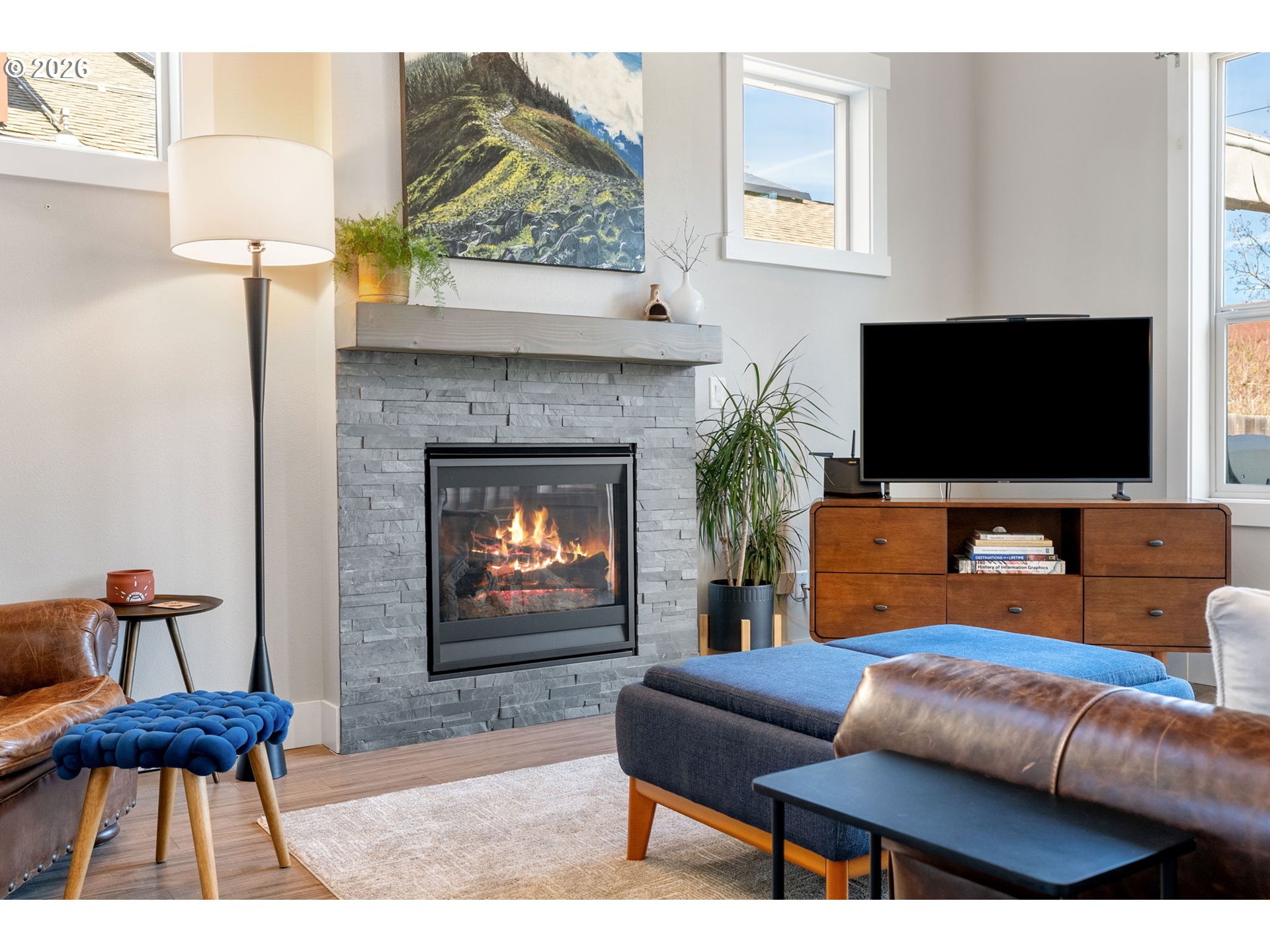 921 Goose Way Hood River, OR 97031 - Photo 5 of 44 a living room with furniture a flat screen tv and a fireplace
