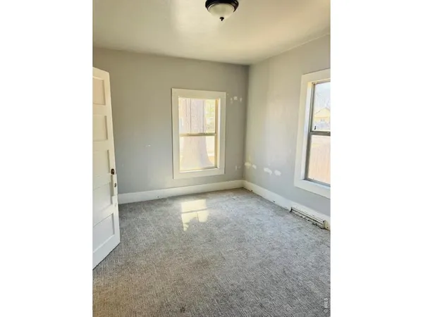 a view of an empty room with a window