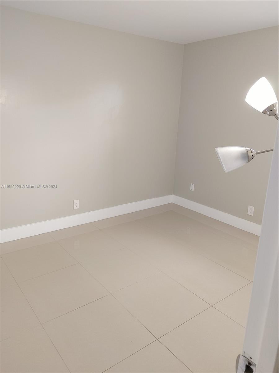 8330 Sands Point Boulevard, Unit N107 Tamarac, FL 33321 - Photo 8 of 13 a view of an empty room