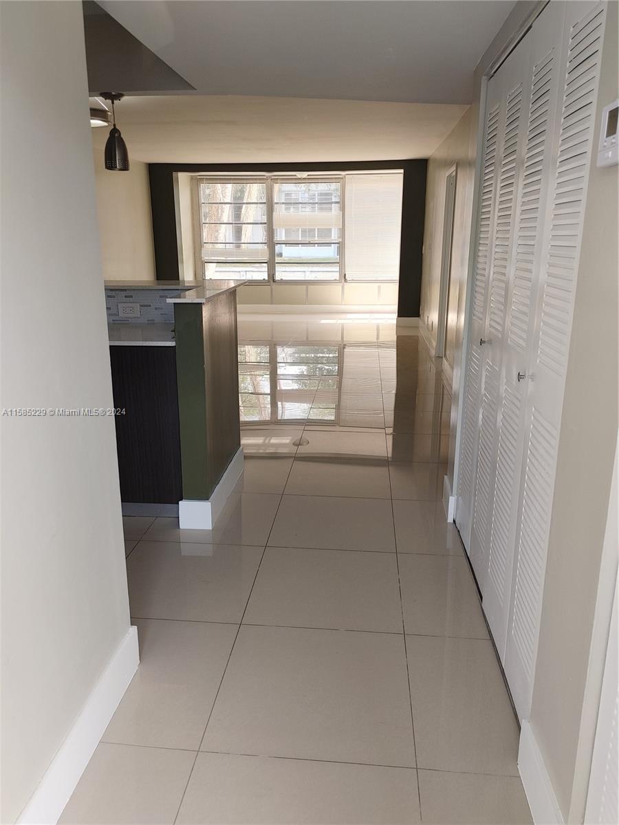 8330 Sands Point Boulevard, Unit N107 Tamarac, FL 33321 - Photo 10 of 13 a view of empty room with window