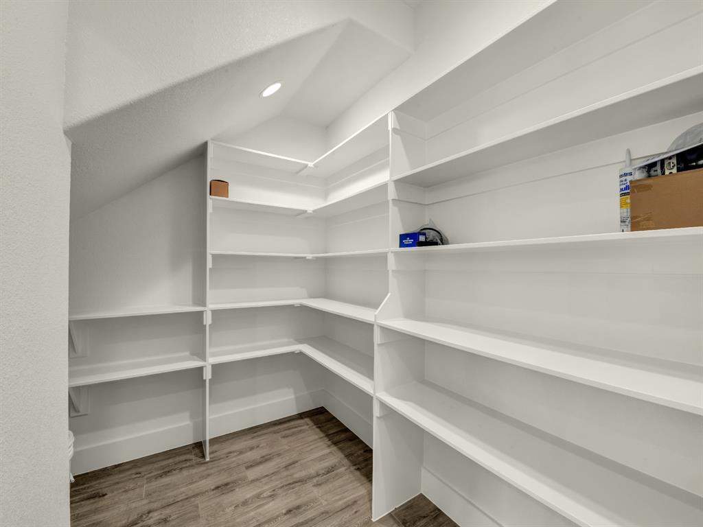 313 Wrangler Court Weatherford, TX 76088 - Photo 24 of 40 a view of walk in closet with empty racks