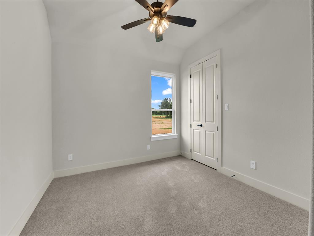 313 Wrangler Court Weatherford, TX 76088 - Photo 29 of 40 a view of an empty room with a window