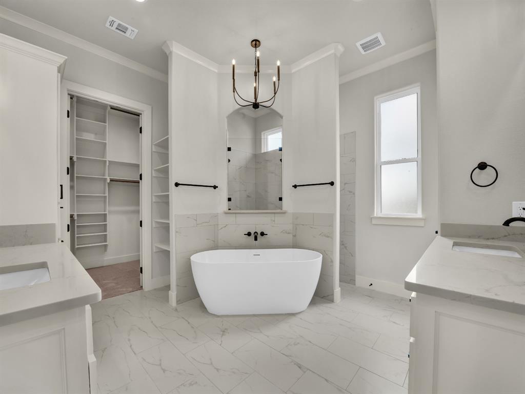 313 Wrangler Court Weatherford, TX 76088 - Photo 33 of 40 a bathroom with a sink and a mirror
