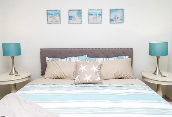 a bedroom with a bed and a dresser in it