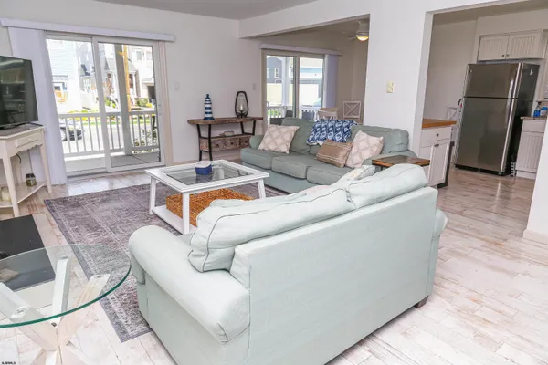 a kitchen with a refrigerator sink stove and cabinets