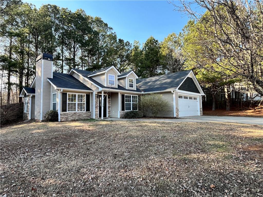 138 West Fork Way Temple, GA 30179 - Photo 2 of 15 a front view of a house with a yard and trees