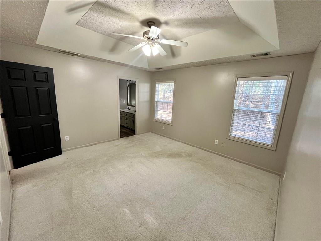 138 West Fork Way Temple, GA 30179 - Photo 7 of 15 a bedroom with a bed and a chandelier