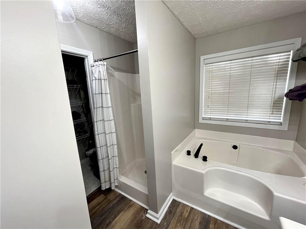 138 West Fork Way Temple, GA 30179 - Photo 9 of 15 a bathroom with a bathtub and a shower