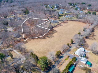 an aerial view of a swimming pool and outdoor space