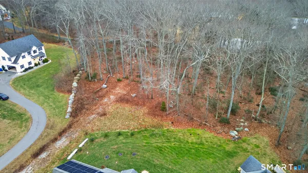 a vase of flowers sitting on a floor