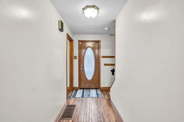 a view of a livingroom with furniture and a floor to ceiling window