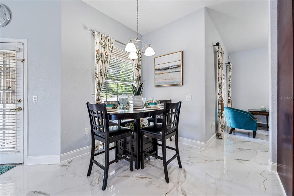 155 Hidden Woods Cove Altamonte Springs, FL 32701 - Photo 12 of 20 a view of a dining room with furniture and window