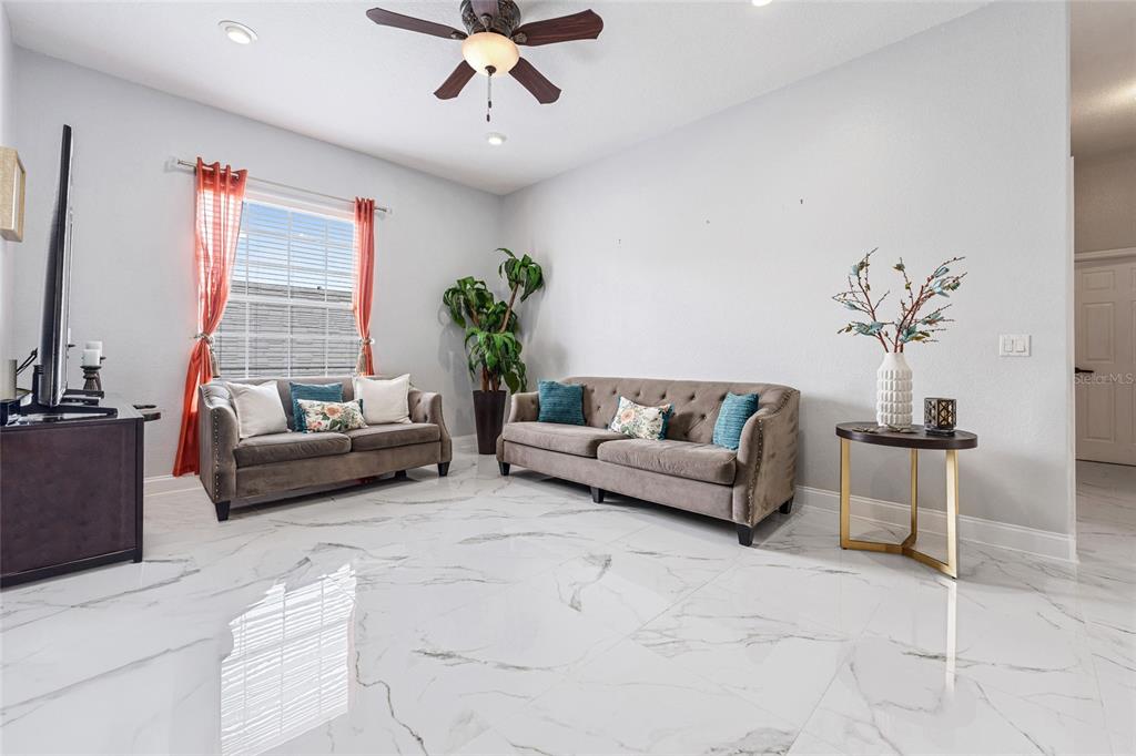 155 Hidden Woods Cove Altamonte Springs, FL 32701 - Photo 13 of 20 a living room with furniture and a potted plant