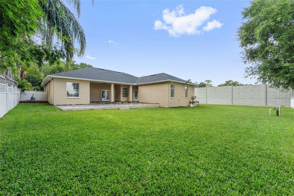 155 Hidden Woods Cove Altamonte Springs, FL 32701 - Photo 19 of 20 a view of a house with a backyard