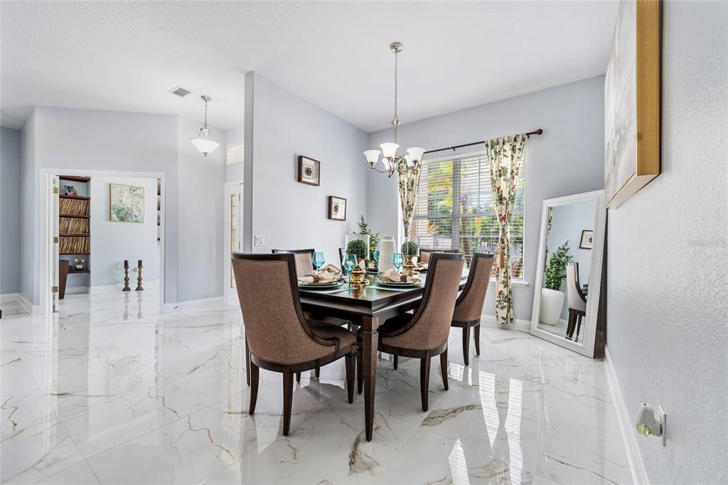 155 Hidden Woods Cove Altamonte Springs, FL 32701 - Photo 3 of 20 a view of a dining room with furniture window and outside view