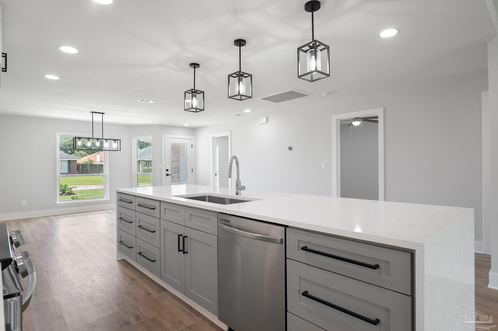 4290 Idell Lane Pace, FL 32571 - Photo 12 of 45 a kitchen with cabinets and window