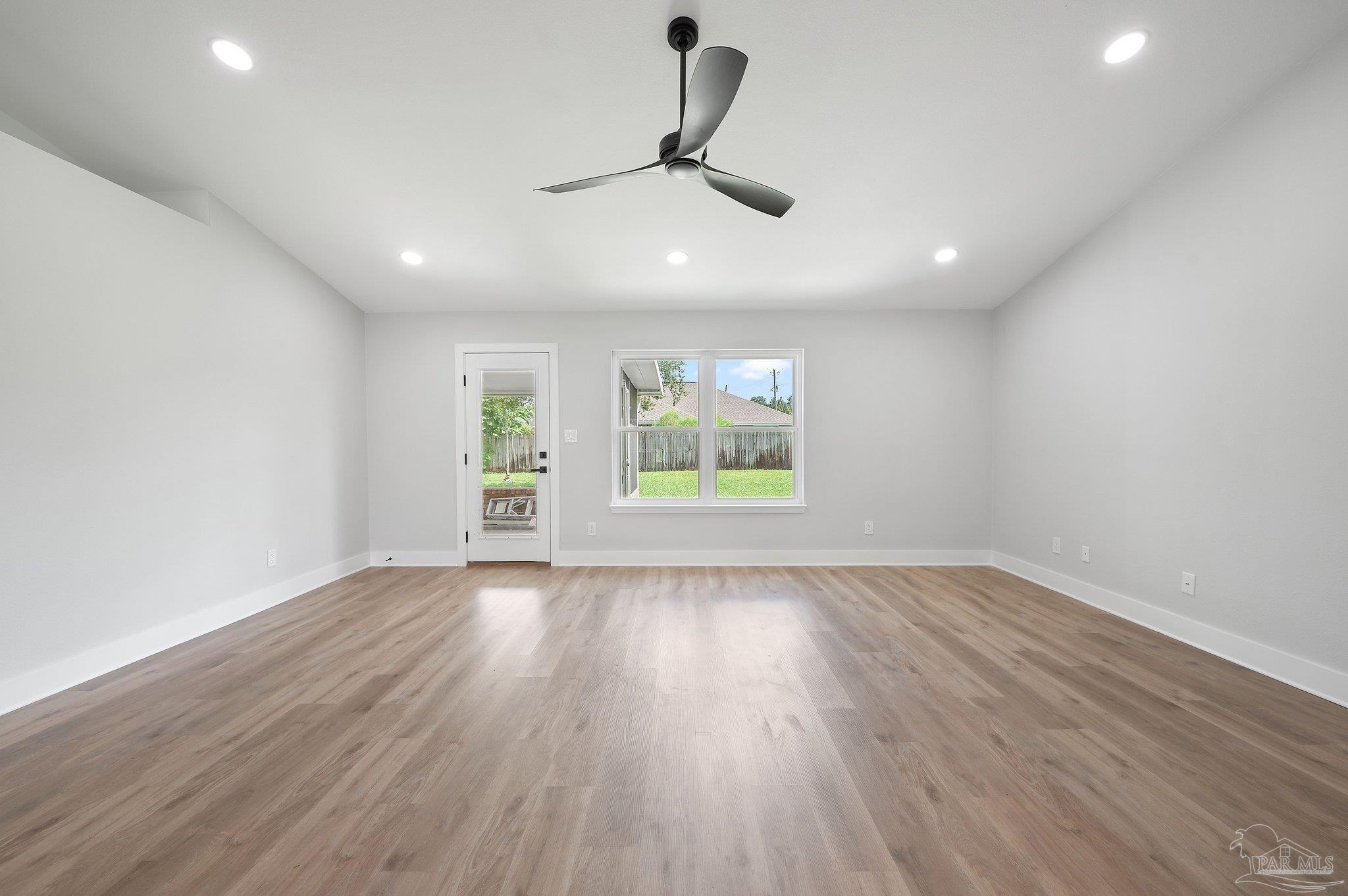 4290 Idell Lane Pace, FL 32571 - Photo 15 of 45 wooden floor in an empty room with a window