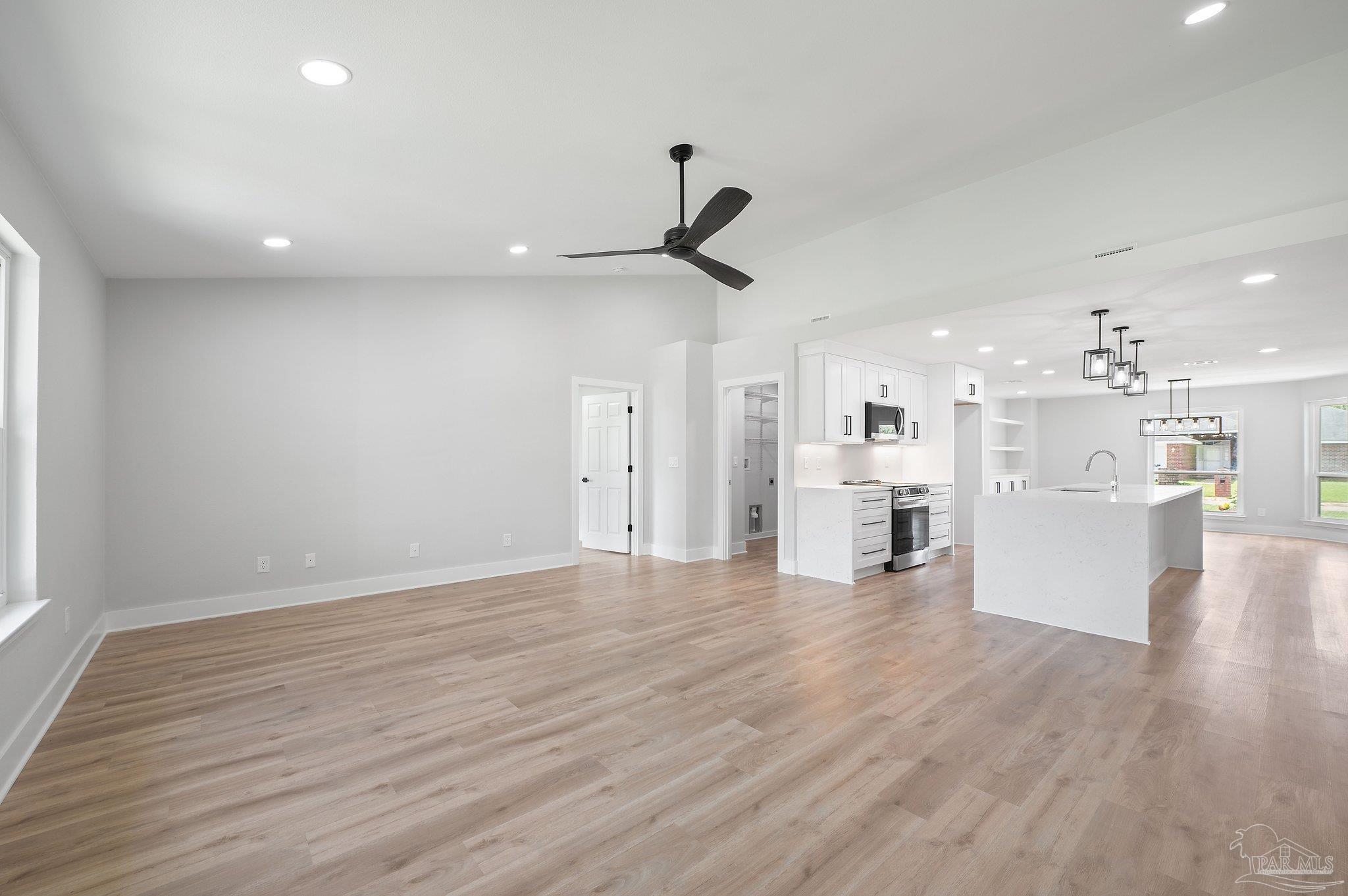 4290 Idell Lane Pace, FL 32571 - Photo 18 of 45 a view of a kitchen with cabinets and wooden floor