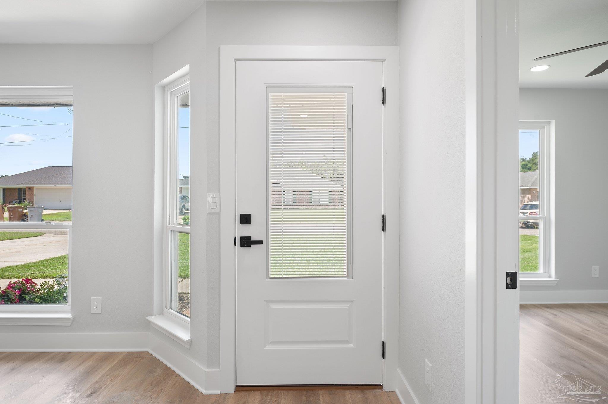 4290 Idell Lane Pace, FL 32571 - Photo 2 of 45 wooden floor with window