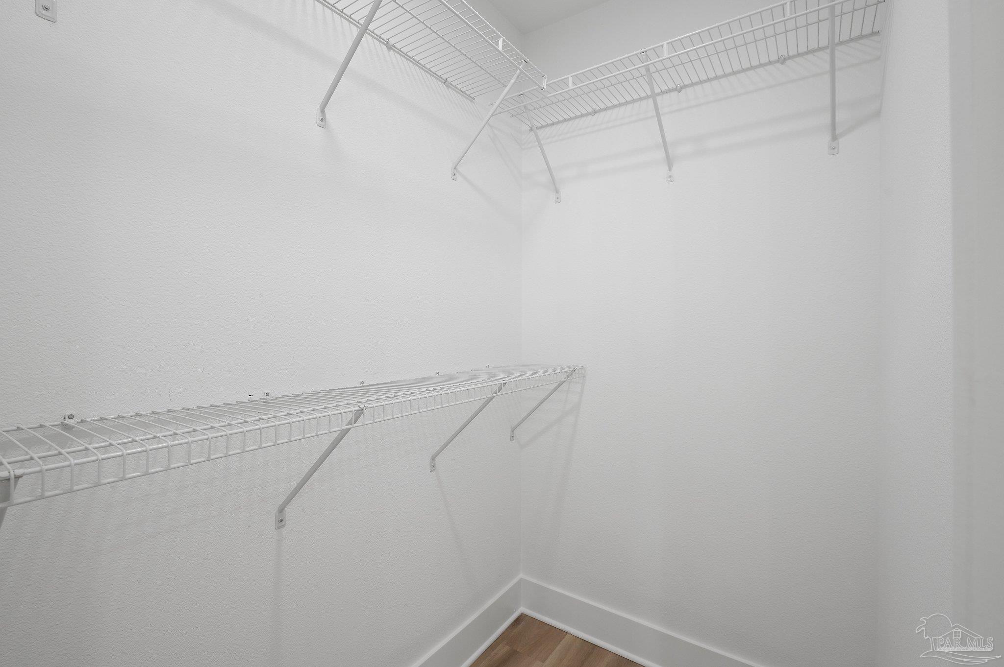 4290 Idell Lane Pace, FL 32571 - Photo 27 of 45 a view of a room with racks on the wall