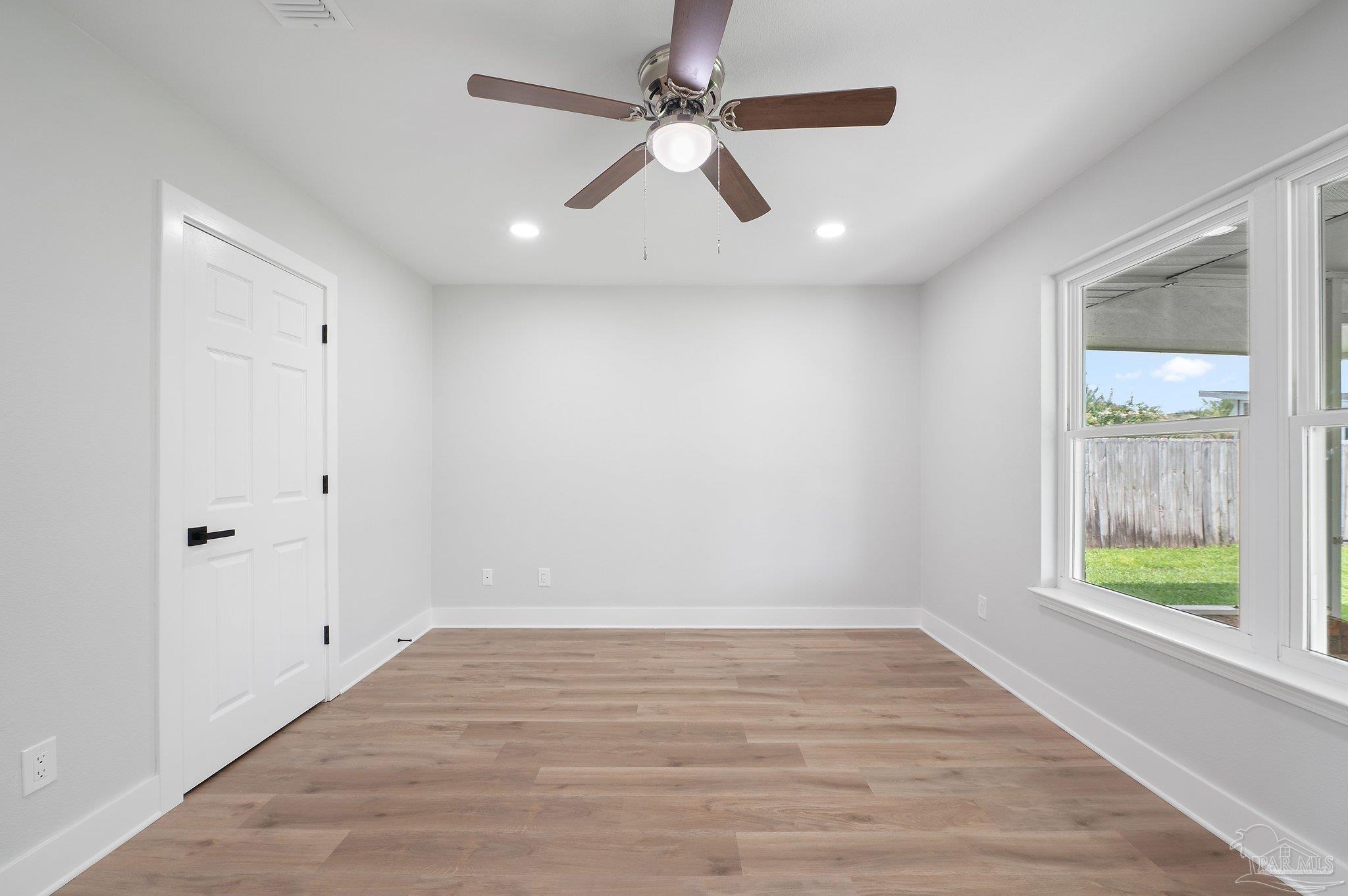 4290 Idell Lane Pace, FL 32571 - Photo 29 of 45 wooden floor in an empty room with a window