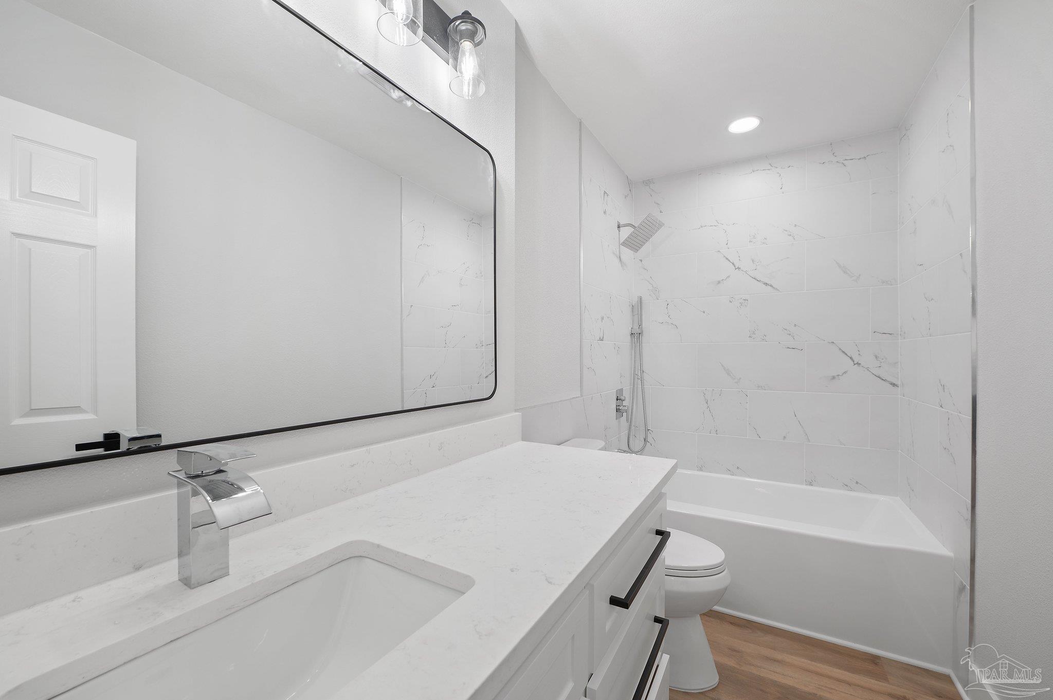 4290 Idell Lane Pace, FL 32571 - Photo 30 of 45 a bathroom with a sink and a tub