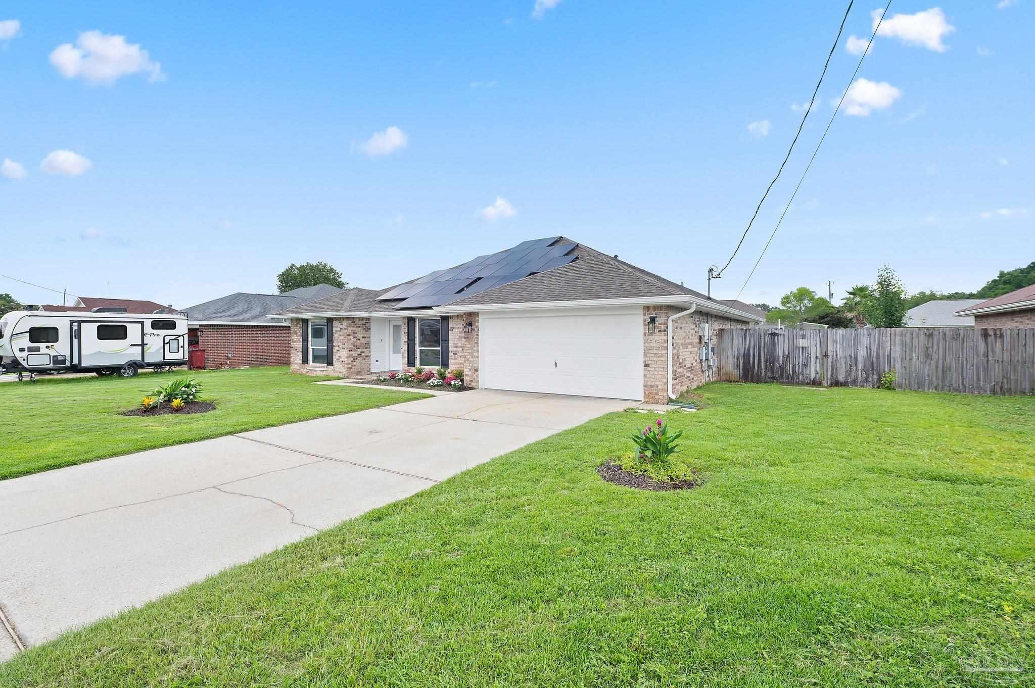 4290 Idell Lane Pace, FL 32571 - Photo 45 of 45 a front view of house with yard and green space