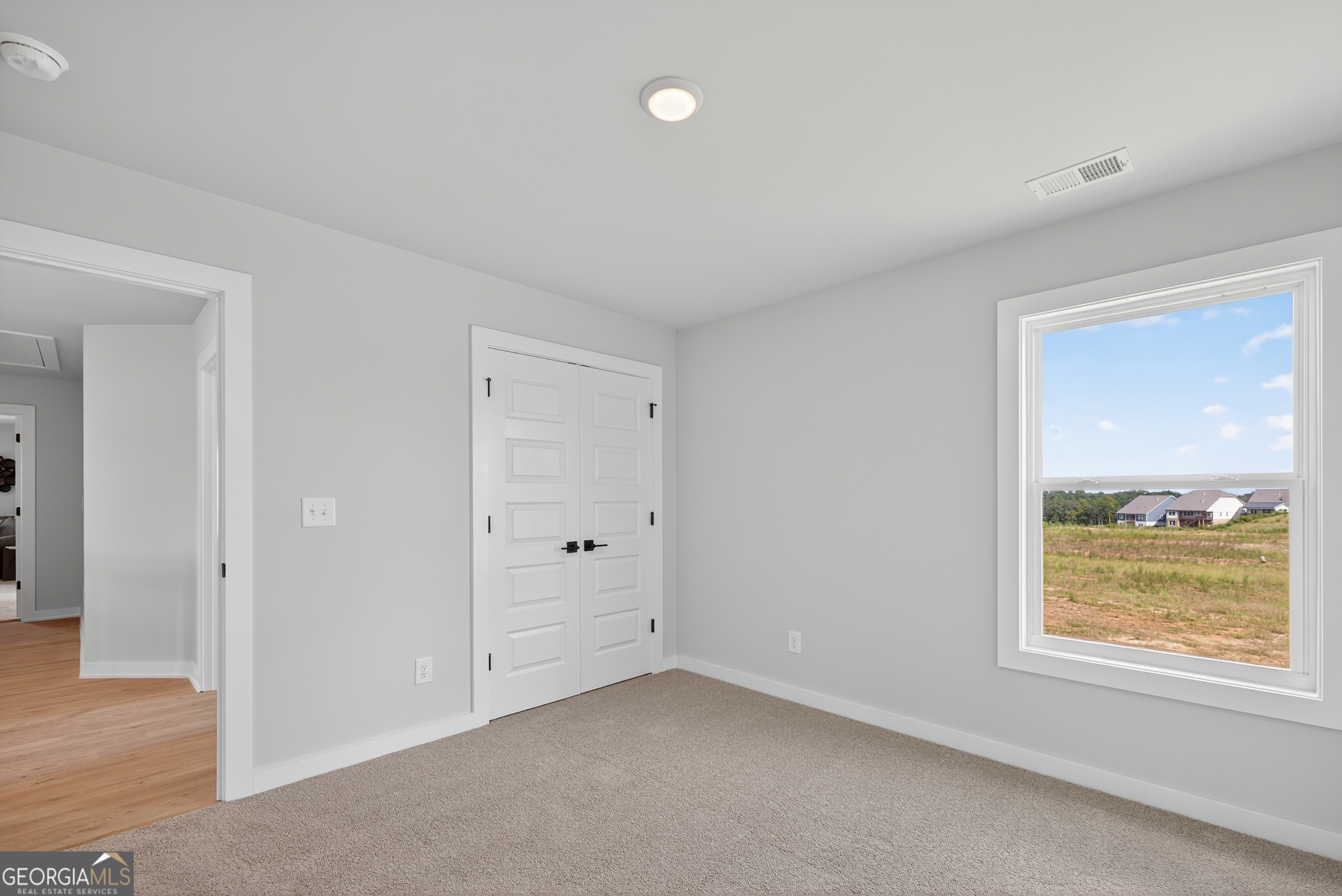 112 Patillo Manor, Unit 3 Stockbridge, GA 30281 - Photo 36 of 59 a view of an empty room with a window