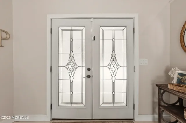 a view of a livingroom with furniture and windows