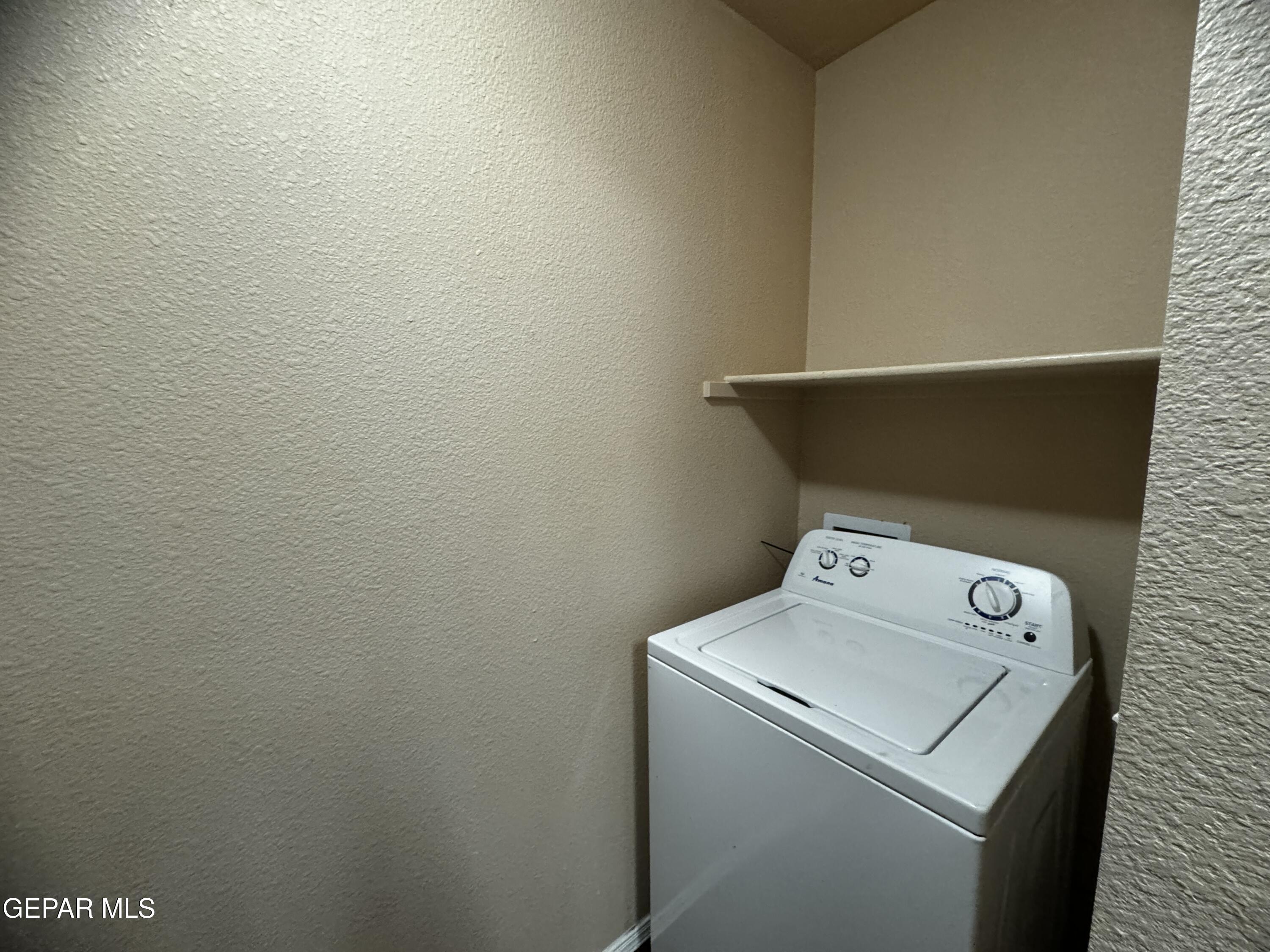 9811 Socorro Road, Unit 36 El Paso, TX 79927 - Photo 6 of 12 a utility room with dryer and washer