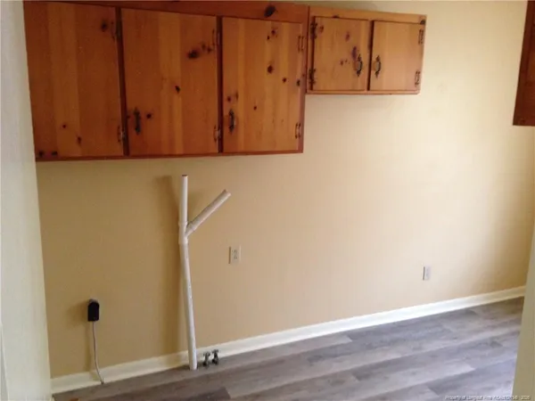 a bathroom with a toilet and a window