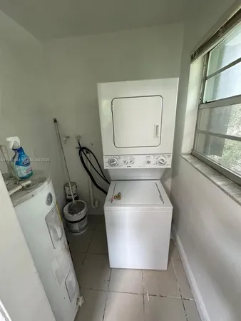a view of kitchen with cabinets and wooden floor