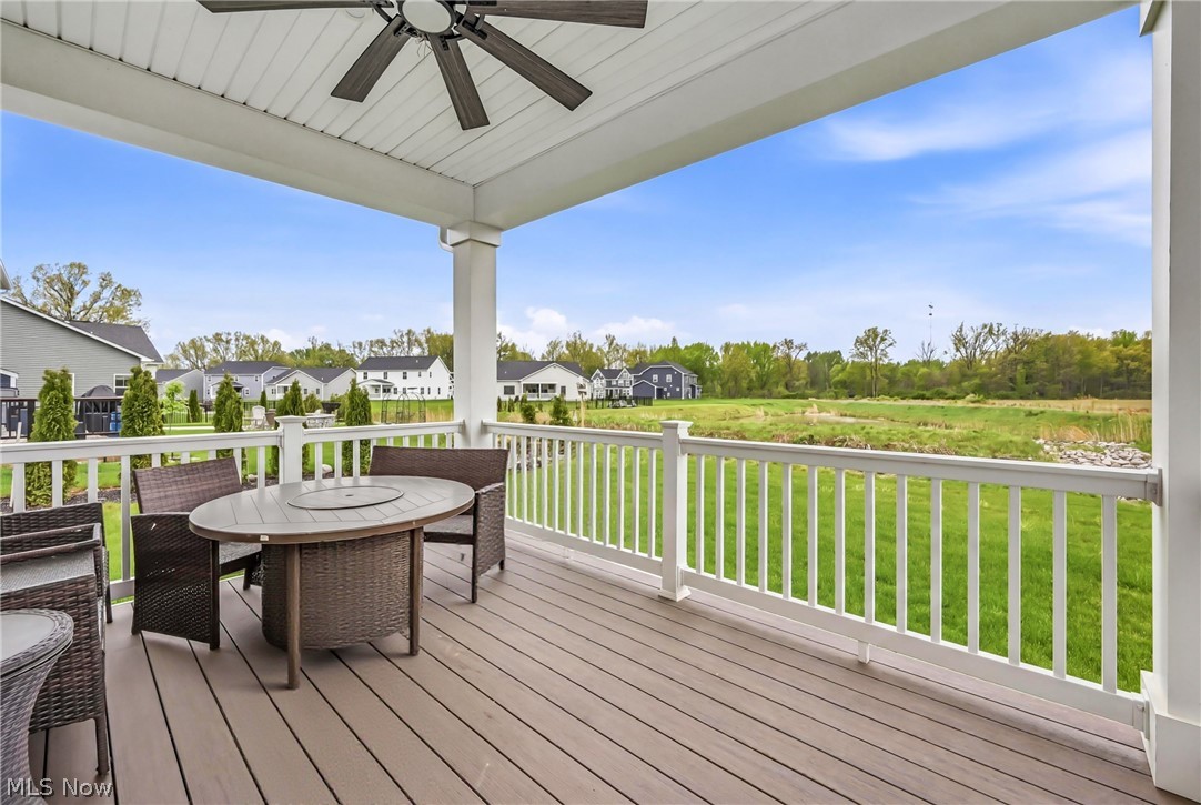 5358 Walnut Rdg Lane Sheffield Lake, OH 44054 - Photo 48 of 50 Covered porch with composite wood-finish decking and white railing overlooking a green space