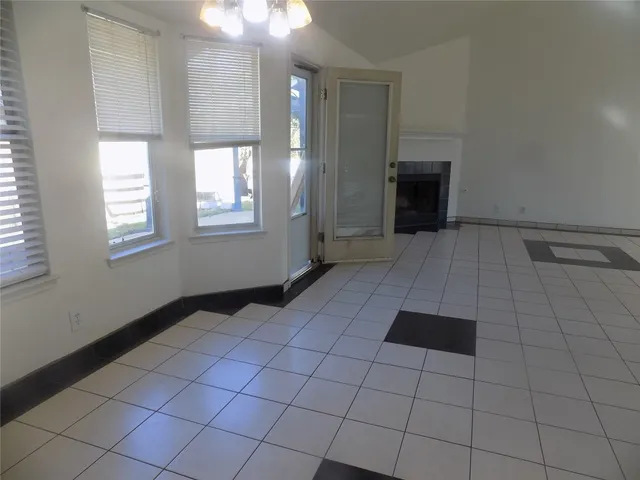 a view of an empty room and window