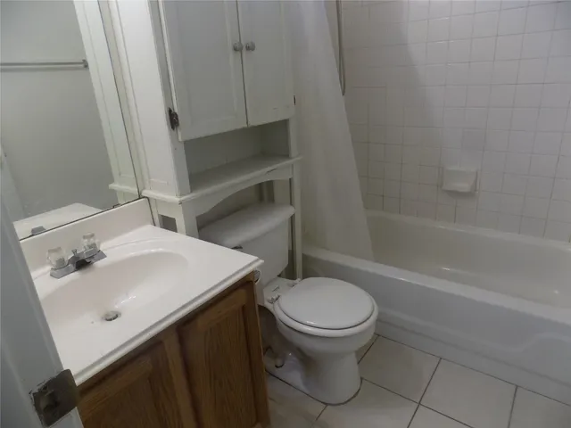 a bathroom with a sink a toilet and bathtub
