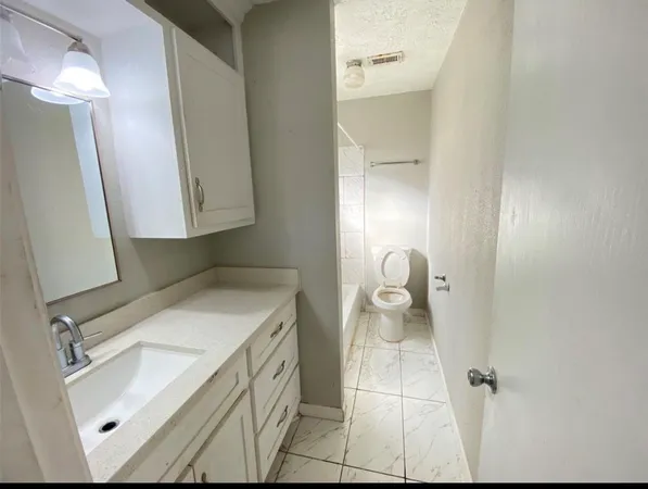 a bathroom with a sink and mirror