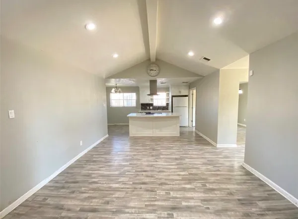 a view of a kitchen with a sink and cabinet