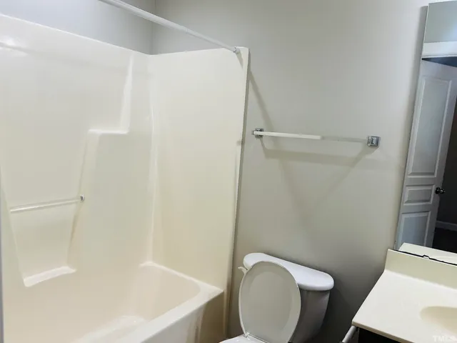 a bathroom with a sink a toilet and a bathtub