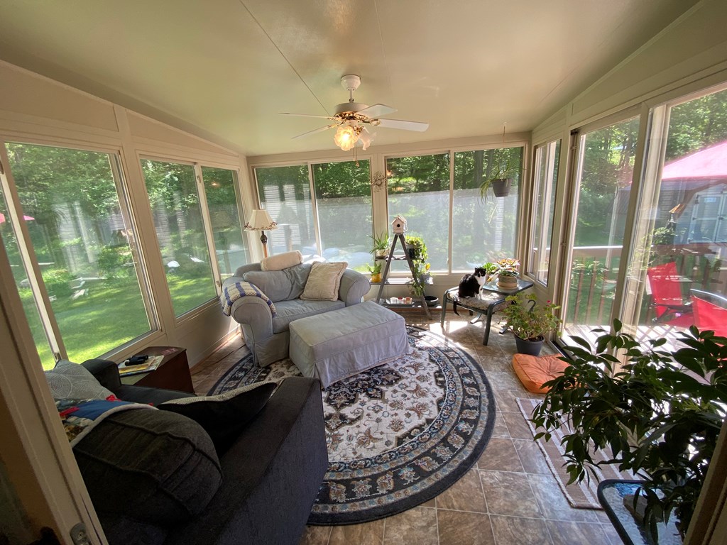 138 Center Church Road Polk, PA 16342 - Photo 21 of 64 a living room with furniture and a floor to ceiling window