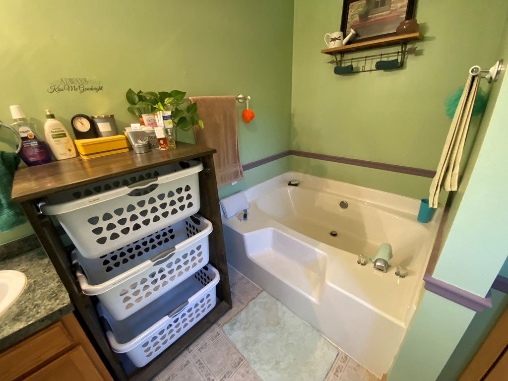 138 Center Church Road Polk, PA 16342 - Photo 35 of 64 a bathroom with a bathtub a sink and a shower