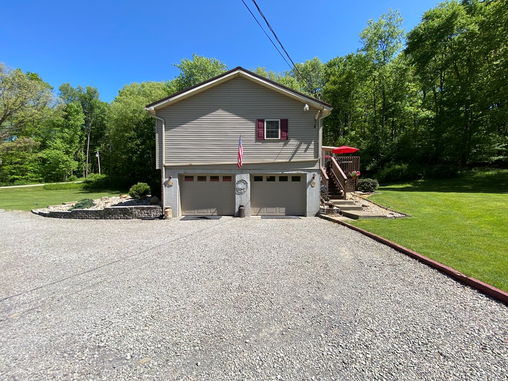 138 Center Church Road Polk, PA 16342 - Photo 8 of 64 a front view of house with yard and trees