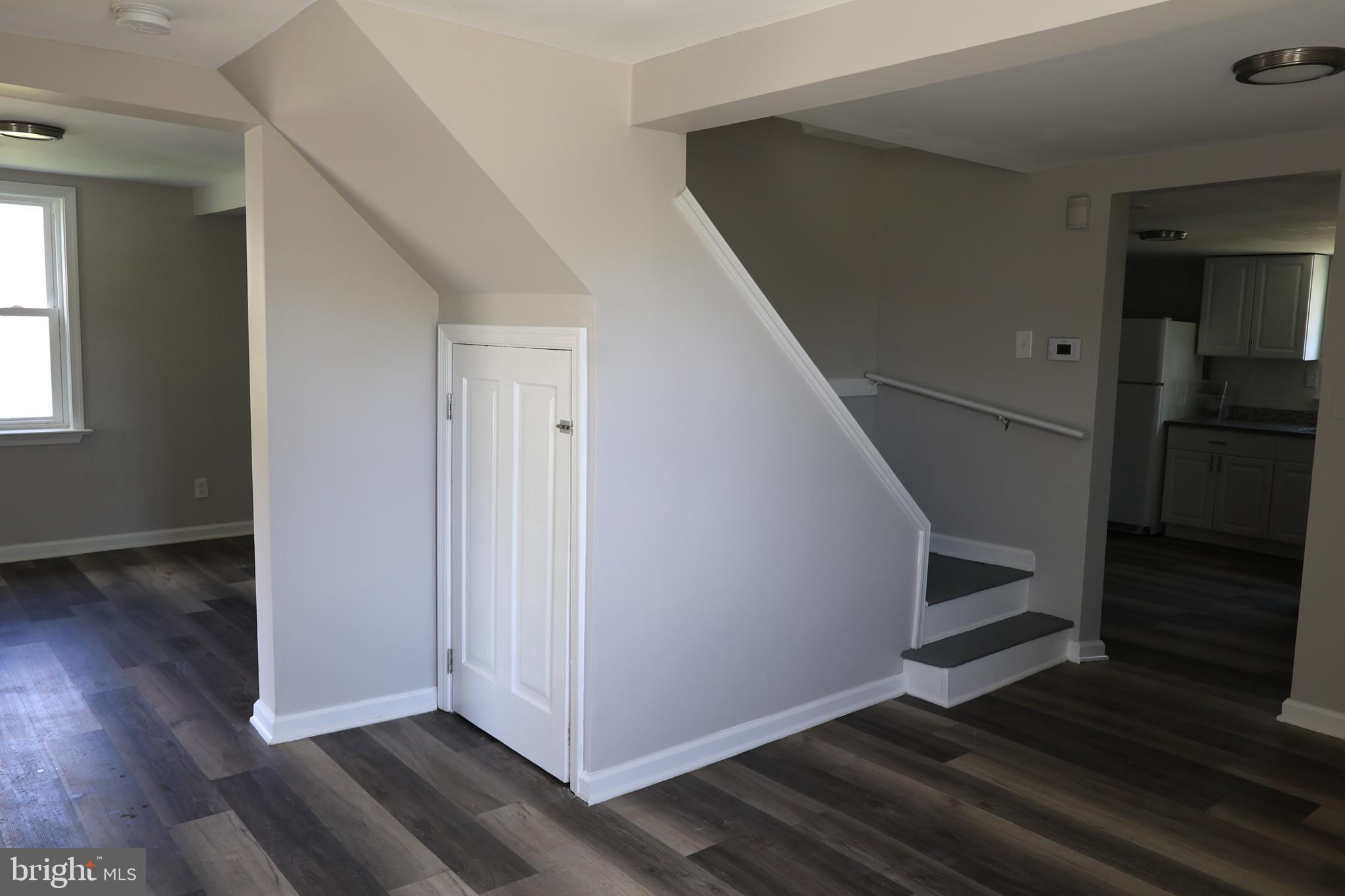 6213 Appletown Road Boonsboro, MD 21713 - Photo 11 of 18 a view of a hallway view with wooden floor and staircase