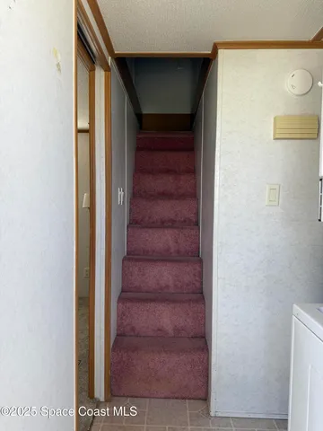 a large kitchen with stainless steel appliances granite countertop a stove and a sink
